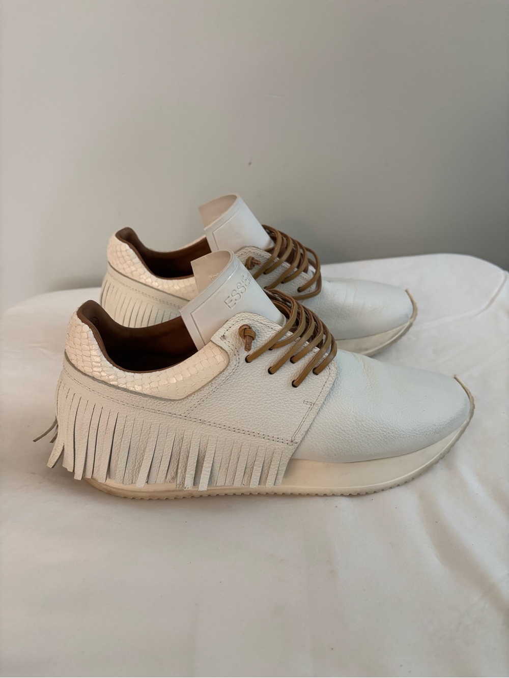 Esseutesse white fringe leather sneakers with tan suede laces